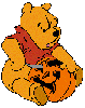 Pooh carving a pumpkin