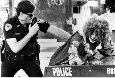 Police arresting clown