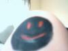 mr bob with red eyes and mouth the rest is black its on my wrist
