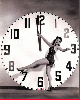 girl playing with a big clock
