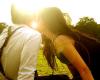 girl and guy kissing in sunshine
